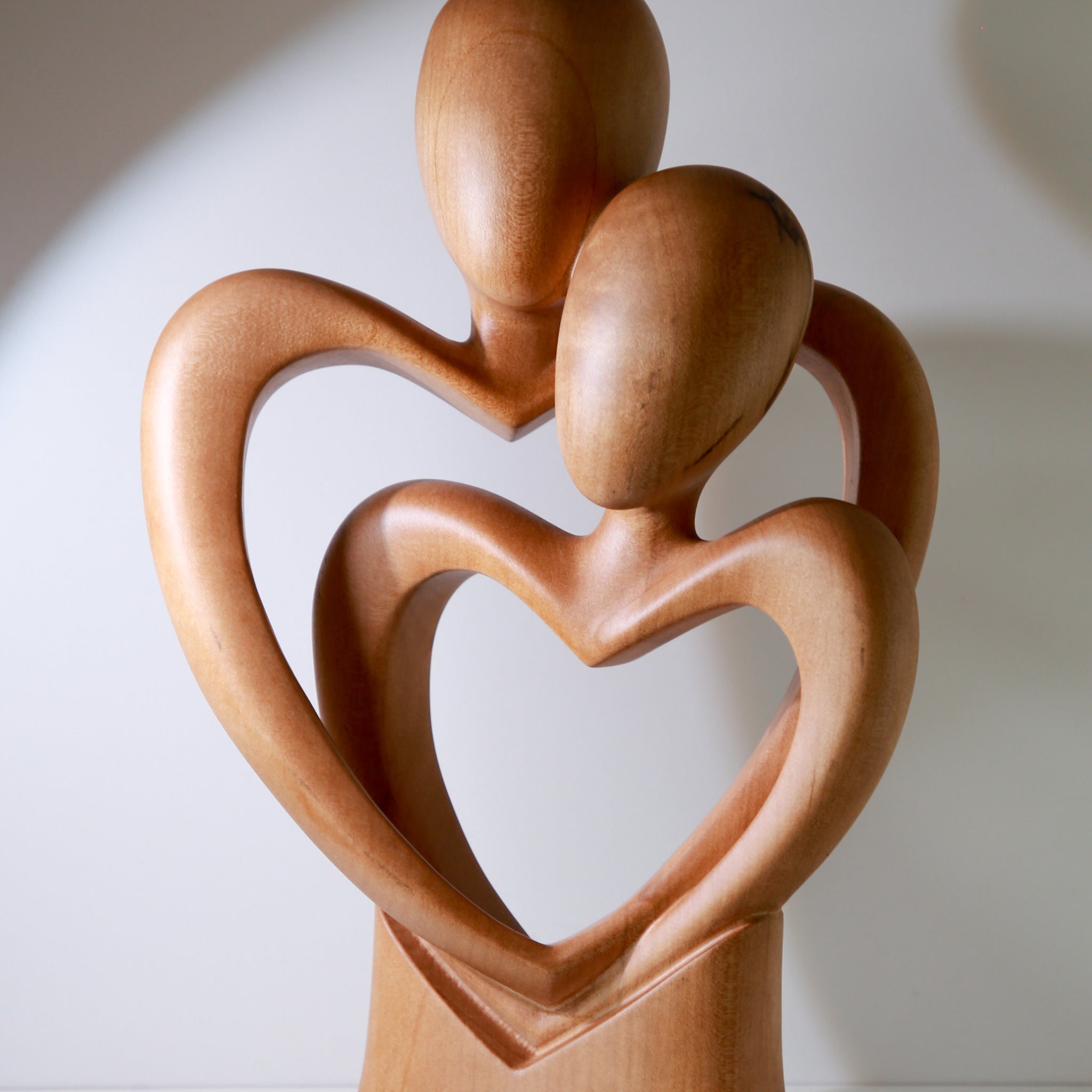 Loving Hearts — Wooden Sculpture of Embrace and Connection
